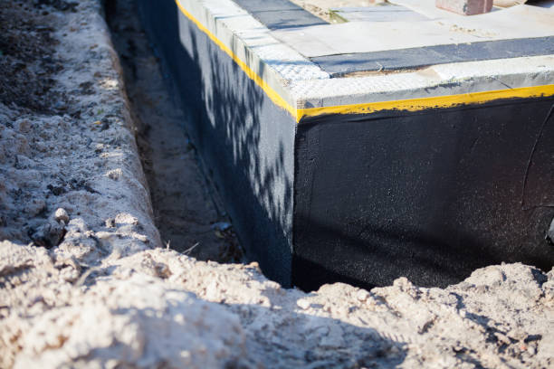 Professional Waterproofing technician working in Robbins, TN